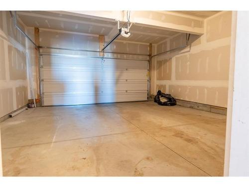 571 Osborne Dr Sw, Airdrie, AB - Indoor Photo Showing Garage