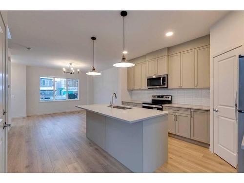 802 Bayview Terrace Sw, Airdrie, AB - Indoor Photo Showing Kitchen With Double Sink With Upgraded Kitchen