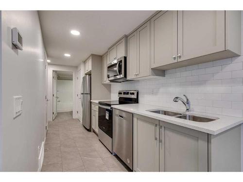 802 Bayview Terrace Sw, Airdrie, AB - Indoor Photo Showing Kitchen With Stainless Steel Kitchen With Double Sink