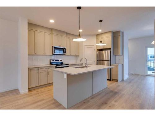 802 Bayview Terrace Sw, Airdrie, AB - Indoor Photo Showing Kitchen With Stainless Steel Kitchen With Upgraded Kitchen