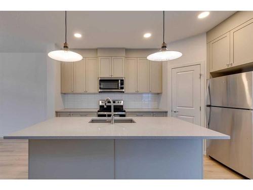 802 Bayview Terrace Sw, Airdrie, AB - Indoor Photo Showing Kitchen With Stainless Steel Kitchen