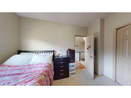 305-176 Kananaskis Way, Canmore, AB - Indoor Photo Showing Bedroom