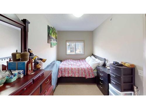 305-176 Kananaskis Way, Canmore, AB - Indoor Photo Showing Bedroom