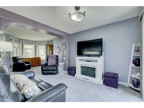 19 Woodside Crescent Nw, Airdrie, AB - Indoor Photo Showing Living Room With Fireplace