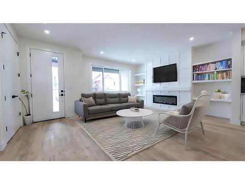 148 Saddlelake Manor Ne, Calgary, AB - Indoor Photo Showing Living Room With Fireplace