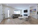 148 Saddlelake Manor Ne, Calgary, AB  - Indoor Photo Showing Living Room With Fireplace 