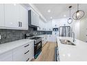 148 Saddlelake Manor Ne, Calgary, AB  - Indoor Photo Showing Kitchen With Double Sink With Upgraded Kitchen 