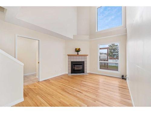 356 River Rock Circle Se, Calgary, AB - Indoor Photo Showing Living Room With Fireplace