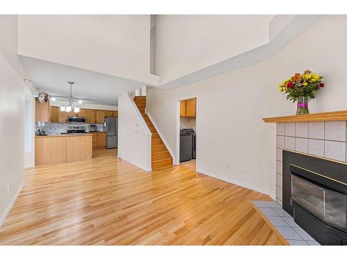 356 River Rock Circle Se, Calgary, AB - Indoor Photo Showing Living Room With Fireplace