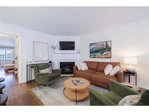 2726 7 Avenue Nw, Calgary, AB - Indoor Photo Showing Living Room With Fireplace