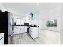 125 Taradale Close Ne, Calgary, AB  - Indoor Photo Showing Kitchen With Double Sink 