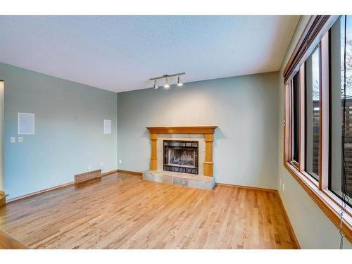 149 Shannon Crescent Sw, Calgary, AB - Indoor Photo Showing Living Room With Fireplace