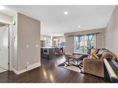 704 Redstone View Ne, Calgary, AB - Indoor Photo Showing Living Room