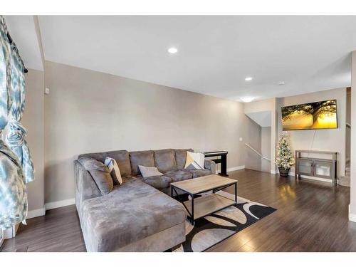 704 Redstone View Ne, Calgary, AB - Indoor Photo Showing Living Room With Fireplace