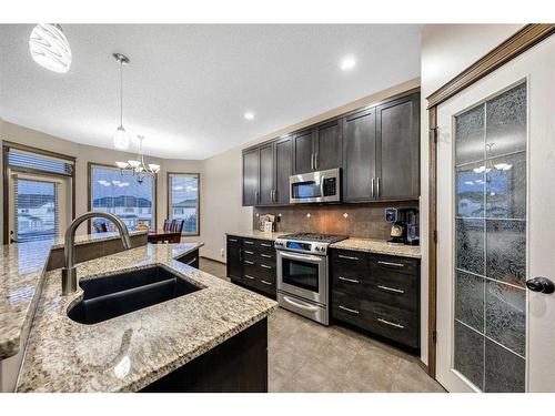 21 Silverado Range Bay Sw, Calgary, AB - Indoor Photo Showing Kitchen With Double Sink With Upgraded Kitchen