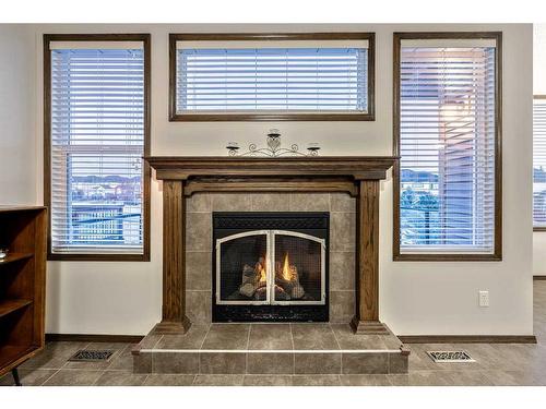 21 Silverado Range Bay Sw, Calgary, AB - Indoor Photo Showing Living Room With Fireplace