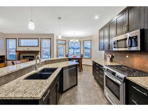 21 Silverado Range Bay Sw, Calgary, AB - Indoor Photo Showing Kitchen With Stainless Steel Kitchen With Double Sink With Upgraded Kitchen