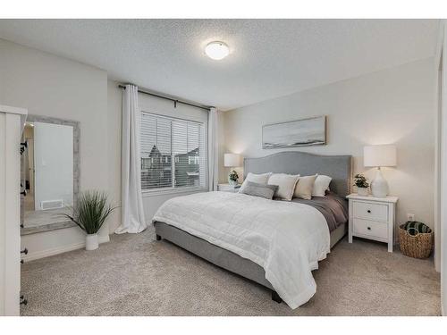 145 Drake Landing Loop, Okotoks, AB - Indoor Photo Showing Bedroom