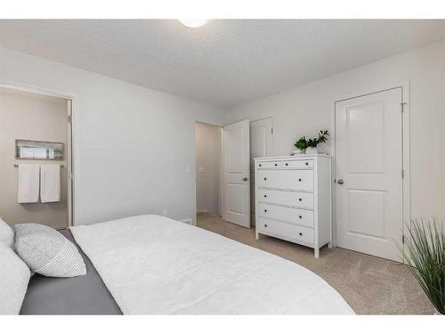 145 Drake Landing Loop, Okotoks, AB - Indoor Photo Showing Bedroom