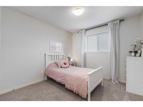 145 Drake Landing Loop, Okotoks, AB - Indoor Photo Showing Bedroom