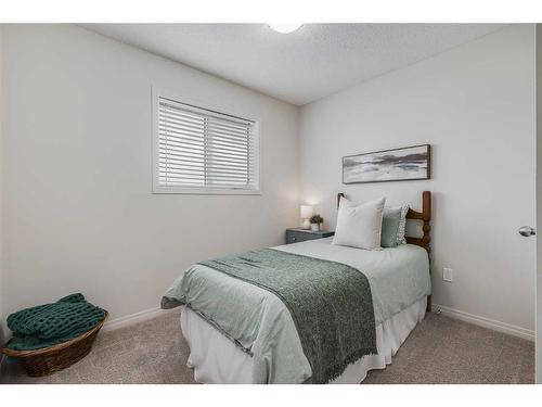 145 Drake Landing Loop, Okotoks, AB - Indoor Photo Showing Bedroom