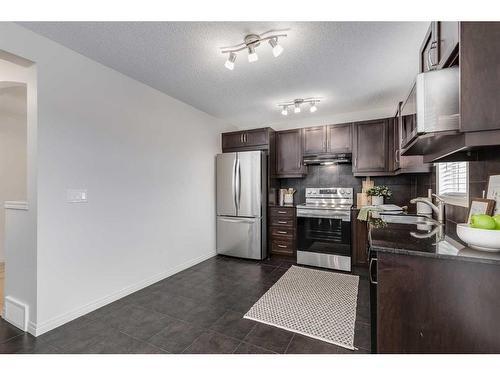 145 Drake Landing Loop, Okotoks, AB - Indoor Photo Showing Kitchen