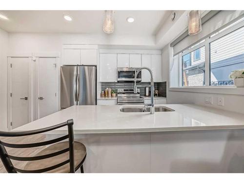 4659 Seton Drive Se, Calgary, AB - Indoor Photo Showing Kitchen With Double Sink With Upgraded Kitchen