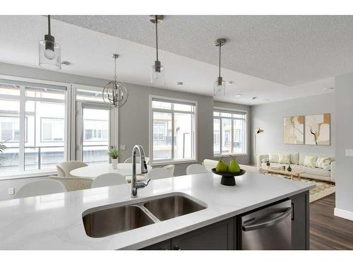 3103-410 Seton Passage Se, Calgary, AB - Indoor Photo Showing Kitchen With Double Sink