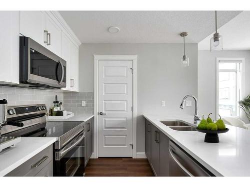 3103-410 Seton Passage Se, Calgary, AB - Indoor Photo Showing Kitchen With Double Sink With Upgraded Kitchen