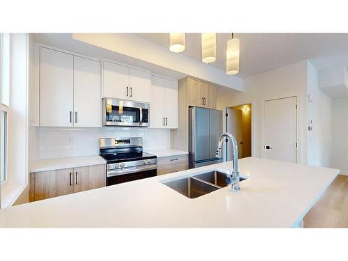 75-2117 81 Street Street Sw, Calgary, AB - Indoor Photo Showing Kitchen With Stainless Steel Kitchen With Double Sink