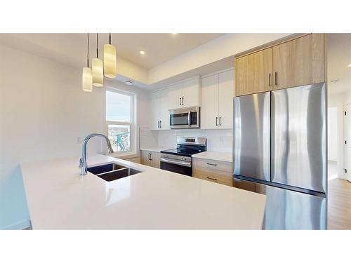 75-2117 81 Street Street Sw, Calgary, AB - Indoor Photo Showing Kitchen With Stainless Steel Kitchen With Double Sink