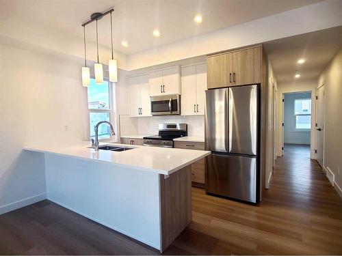 75-2117 81 Street Street Sw, Calgary, AB - Indoor Photo Showing Kitchen With Stainless Steel Kitchen With Double Sink With Upgraded Kitchen