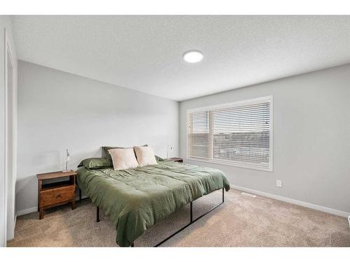 180 Rowmont Boulevard Nw, Calgary, AB - Indoor Photo Showing Bedroom