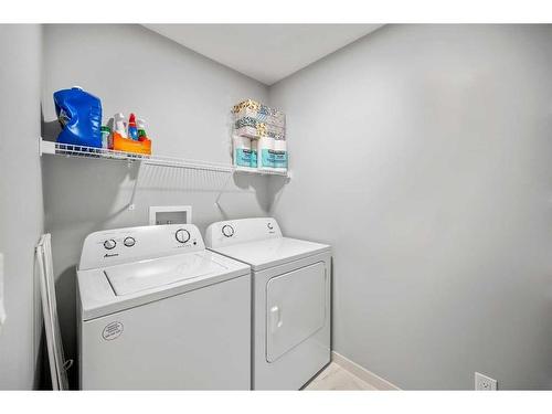 180 Rowmont Boulevard Nw, Calgary, AB - Indoor Photo Showing Laundry Room