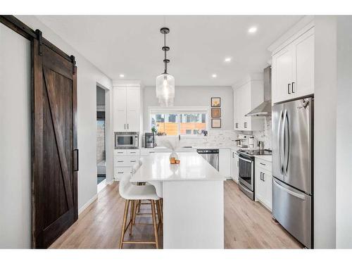 180 Rowmont Boulevard Nw, Calgary, AB - Indoor Photo Showing Kitchen With Stainless Steel Kitchen With Upgraded Kitchen