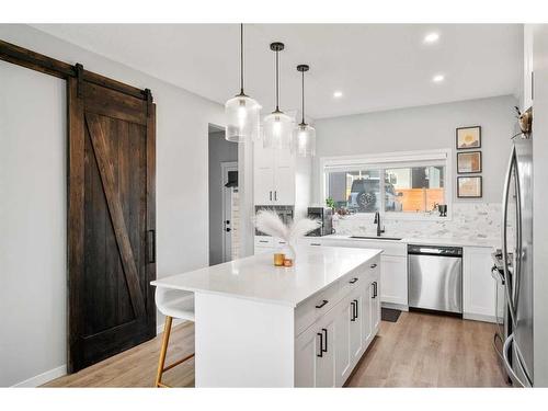 180 Rowmont Boulevard Nw, Calgary, AB - Indoor Photo Showing Kitchen With Stainless Steel Kitchen With Upgraded Kitchen