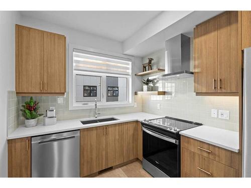 110-8235 8 Avenue, Calgary, AB - Indoor Photo Showing Kitchen With Stainless Steel Kitchen With Double Sink