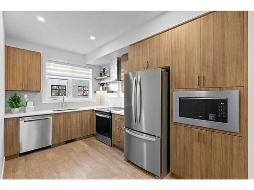 110-8235 8 Avenue, Calgary, AB - Indoor Photo Showing Kitchen With Stainless Steel Kitchen