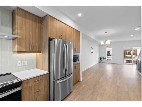 110-8235 8 Avenue, Calgary, AB - Indoor Photo Showing Kitchen With Stainless Steel Kitchen