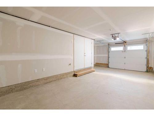 110-8235 8 Avenue, Calgary, AB - Indoor Photo Showing Garage