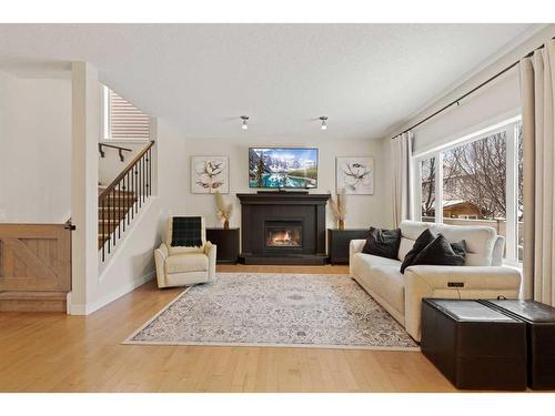 46 West Pointe Manor, Cochrane, AB - Indoor Photo Showing Living Room With Fireplace