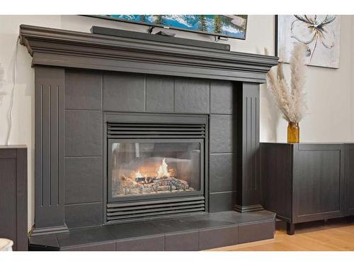 46 West Pointe Manor, Cochrane, AB - Indoor Photo Showing Living Room With Fireplace