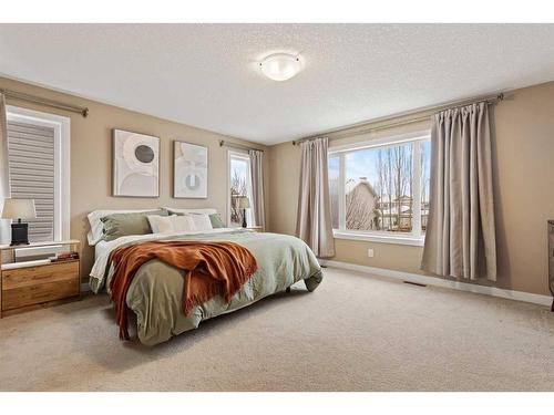 46 West Pointe Manor, Cochrane, AB - Indoor Photo Showing Bedroom