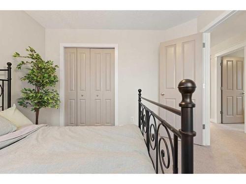 46 West Pointe Manor, Cochrane, AB - Indoor Photo Showing Bedroom