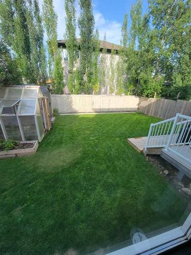 46 West Pointe Manor, Cochrane, AB - Outdoor With Backyard