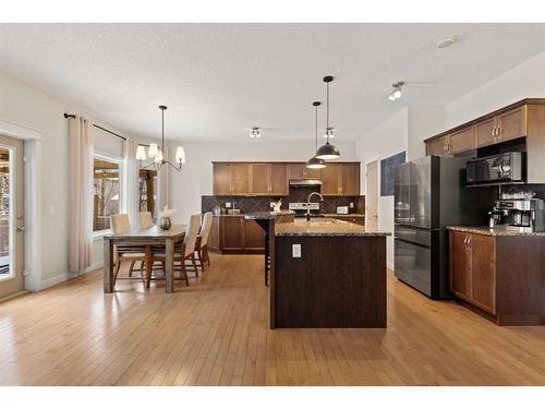 46 West Pointe Manor, Cochrane, AB - Indoor Photo Showing Kitchen With Stainless Steel Kitchen With Upgraded Kitchen