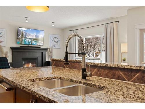 46 West Pointe Manor, Cochrane, AB - Indoor Photo Showing Kitchen With Double Sink