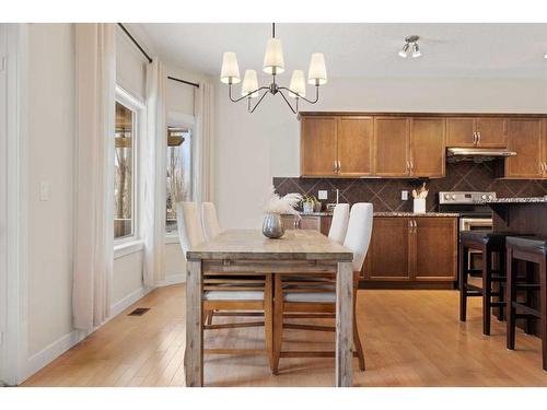 46 West Pointe Manor, Cochrane, AB - Indoor Photo Showing Dining Room