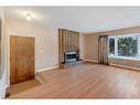 3107 Leduc Crescent Sw, Calgary, AB  - Indoor Photo Showing Living Room With Fireplace 