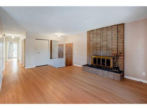 3107 Leduc Crescent Sw, Calgary, AB - Indoor Photo Showing Living Room With Fireplace